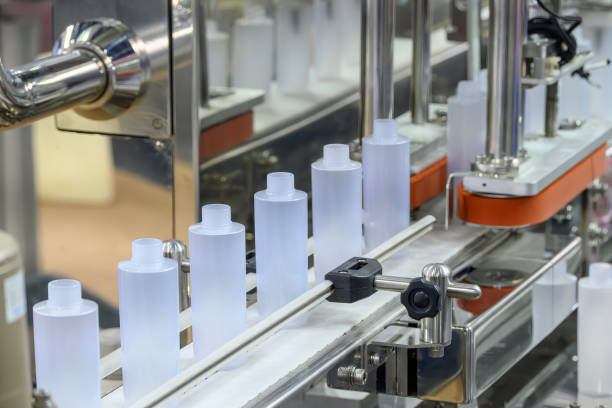 The hi-technology of healthy drinking bottle manufacturing process. The  empty drinking water bottles  on the conveyor belt for filling process.