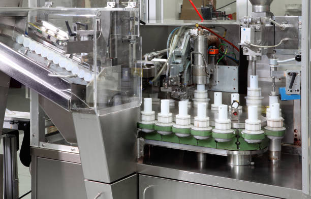 A high speed modern tube filling machine in a cosmetics factory.