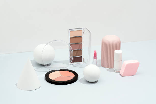 Cosmetics flat lay, packaging mockup, template with geometric objects on white and gray background. Eye shadow, lipstick, nail polish, blusher,  makeup palette with sphere, cone and geometric shape objects.