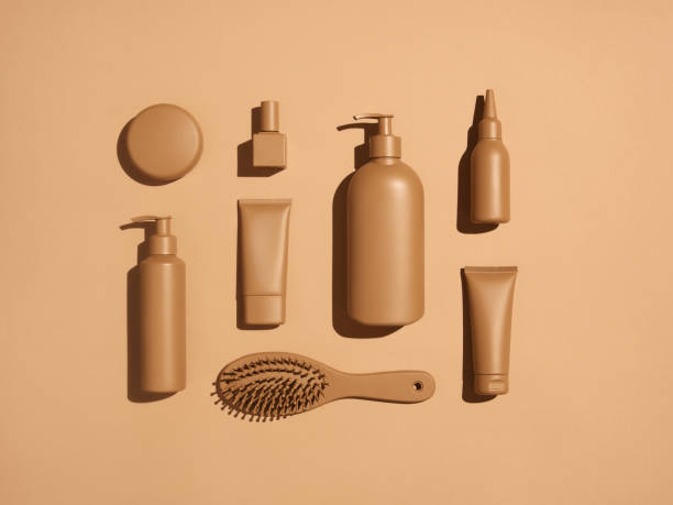 Flat lay photo of hand-painted beauty products in monochrome beige color